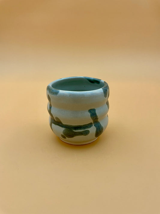 Curved mini cup