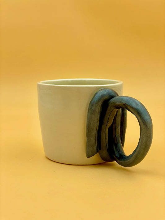 Large cup with twisted handle